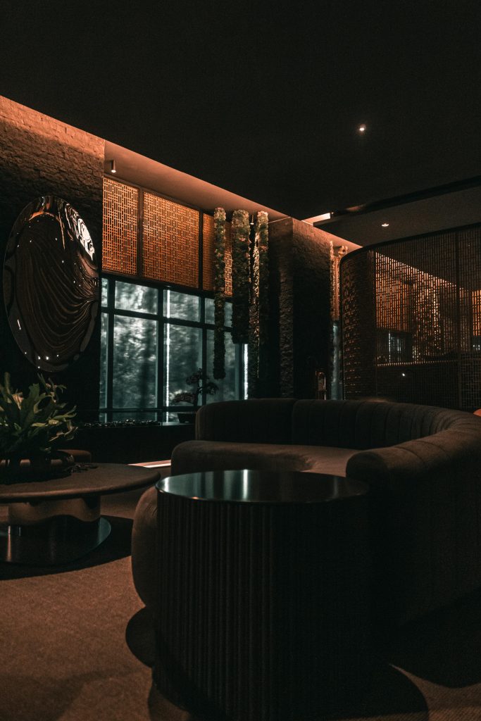 Elegant living room showcasing modern luxury design with ambient lighting and stylish furnishings.